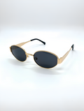 Gold-framed sunglasses with black lenses on a white background